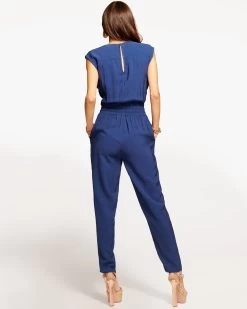 Bria Smocked Jumpsuit 19 Bria Smocked Jumpsuit -Urban Chic Shop rtw 2023 may 1 A05235012 BRIAJUMPSUIT SPRING NAVY 04